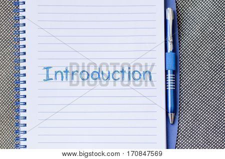 Introduction text concept write on notebook .