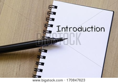 Introduction text concept write on notebook .