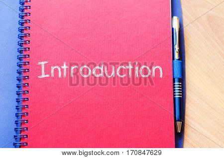 Introduction text concept write on notebook .