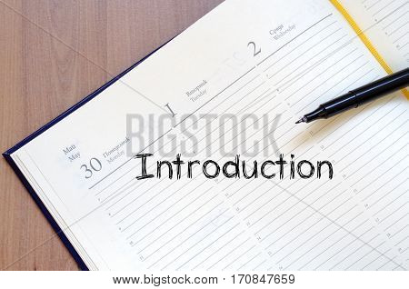 Introduction text concept write on notebook .