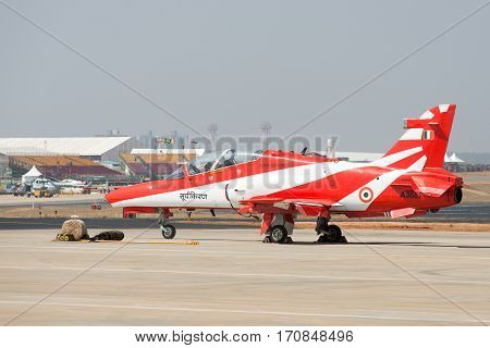 Bangalore India - February 12 2017: A plane from the Surya Kiran acrobatic team at the 11th edition of Aero India 2017 in Bangalore India. Over 200000 people are expected to attend.