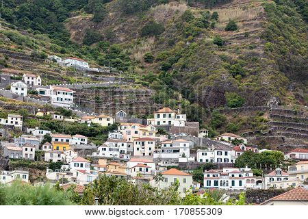 Fields and houses along west coast near Porto Moniz on Madeira Island. Portugal