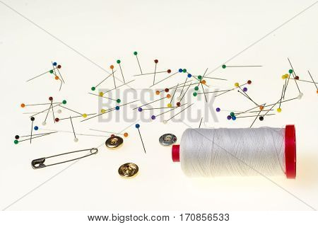 Background with a Multitude of Pins with the Head in Various Colors isolated in white