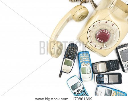 Old telephone and moblie phone on white background