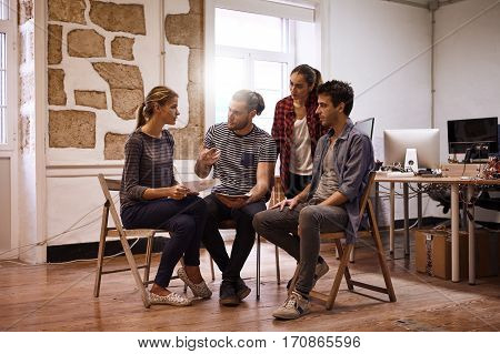 Young Business Team Gathered In Discussion