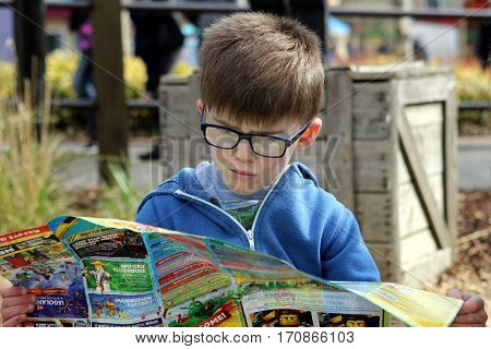 April 04 2016 - Windsor, Uk: A Young Boy Studies The Map Of The Legoland Theme Park