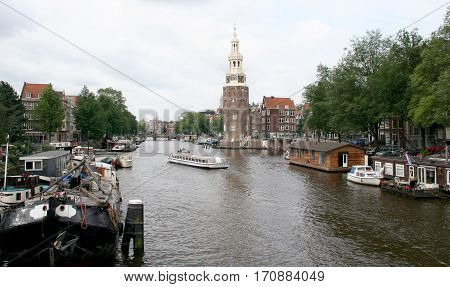 The Montelbaanstoren Is A Tower On Bank Of The Canal Oudeschans In Amsterdam