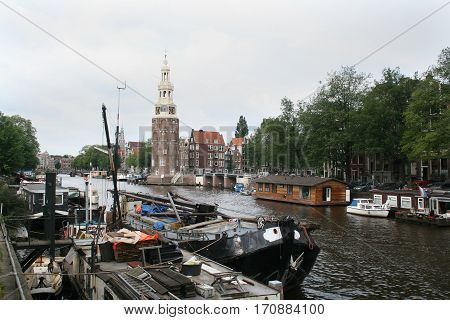 The Montelbaanstoren Is A Tower On Bank Of The Canal Oudeschans In Amsterdam