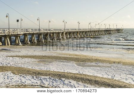 baltic sea and pier in gdynia orlowo in poland in wintertime, europe