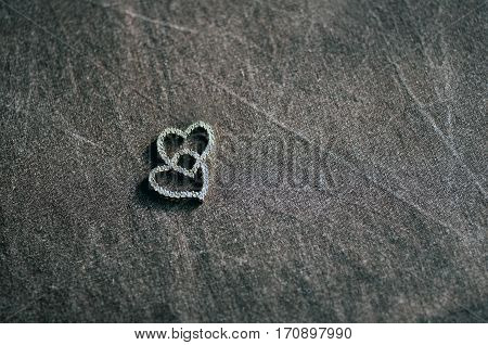 Two Gold Hearts Pendant On Textile Background , Love Concept For Valentine Day