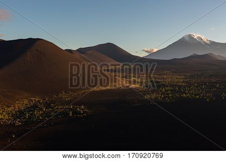 Volcanoes and Dead wood at dawn - consequence of a catastrophic release of ash during the eruption of the volcano in 1975 Tolbachik north breakthrough