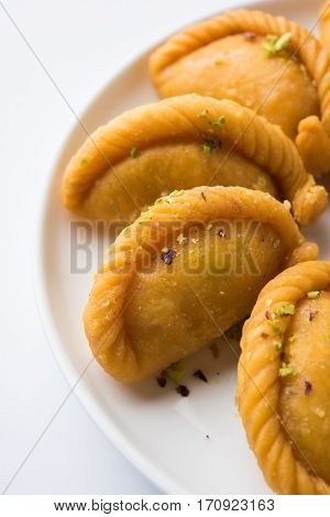 Gujiya - sweet dumplings made during the festival of holi and diwali, selective focus