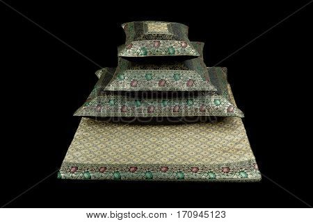 linens and pillows on a black background