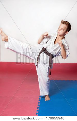 Children during training in karate. Fighting position active lifestyle practicing fighting techniques