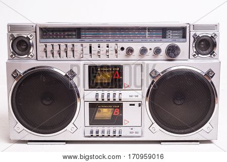 Front View of a Vintage Boom Box Cassette Tape Player Isolated on White Background.