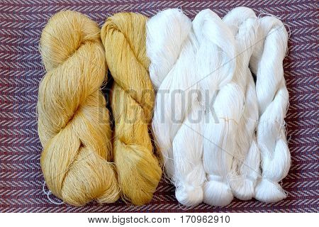 Yellow and white silk prepared for staining.