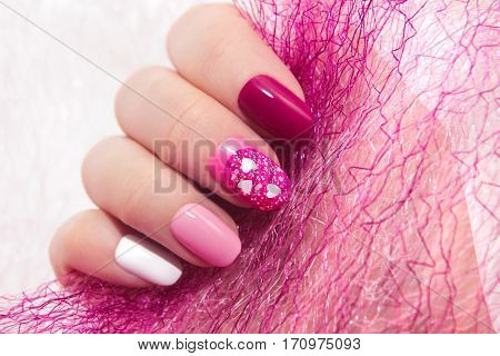 Pink cherry nail design for nail glitter different shapes closeup.