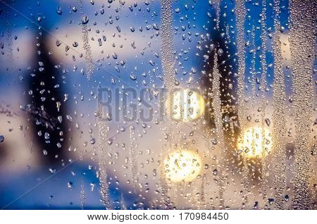 Condenced water drops on a blurred background with lights