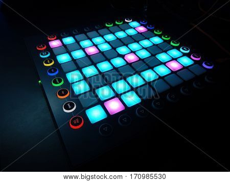 glowing Launchpad on black background for electronic dance music lovers