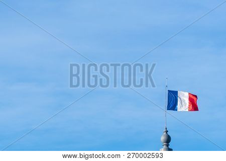 National Flag Of France On A Flagpole Waving Blown And Ripple Away By Wind With Beautiful Blue Sky,c