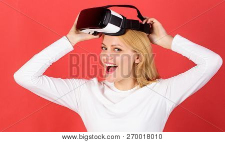 The Woman With Glasses Of Virtual Reality. Person With Virtual Reality Helmet Isolated On Red Backgr