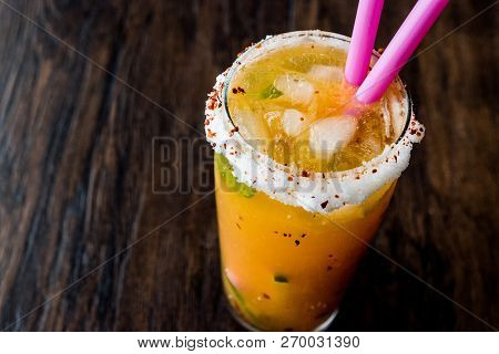 Mexican Michelada Cocktail With Beer, Lime, Ice And Spices..