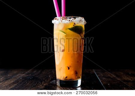 Mexican Michelada Cocktail With Beer, Lime, Ice And Spices..
