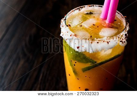 Mexican Michelada Cocktail With Beer, Lime, Ice And Spices..