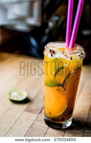 Mexican Michelada Cocktail With Beer, Lime, Ice And Spices..