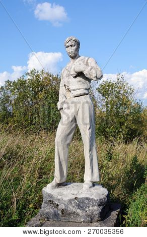Fedovo Village, Arkhangelsk Region, Russia - September 10, 2014: Abandoned Destroyed Statue Of Young