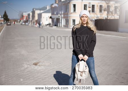 Street Fashion Look. Beautiful Girl In Black Hoody