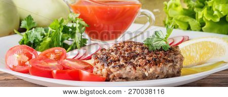 Chopped Steak Cutlet Cooked On Grill On White Plate With Assorty Mix Vegetables Radish Cherry Tomato