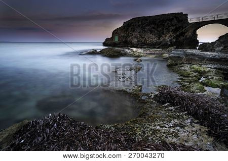 Rocky Arch With Green Door In Cala Major, Mallorca, Spain