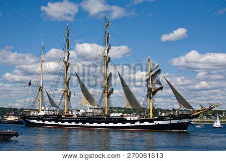 HALIFAX, NOVA SCOTIA, CANADA - AUG 20, 2009: The Kruzenshtern, sails down Halifax Harbour during the sailpast of the Nova Scotia Tall Ships Festival 2009.