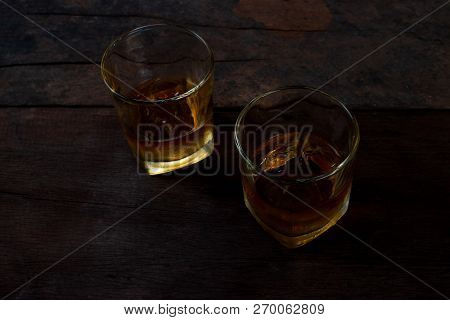 Glass Of Scotch Whiskey On A Dark Background