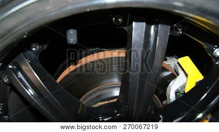 Disc Brake Car / Pads Of Disc Brake With Rust On Disc In Wheel Car Close Up - Rusty Steel On Black C