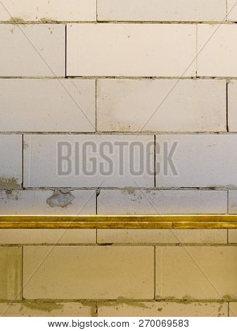 Details Of House Home Construction Site. Provisional Walls Made Of Grey Blocks.