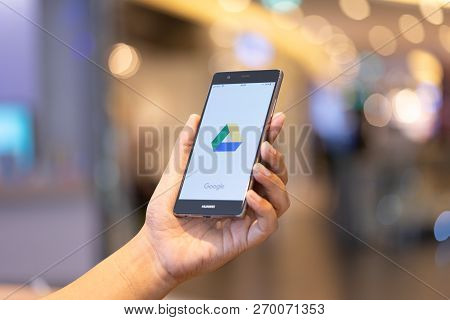 Chiang Mai, Thailand - Oct. 28,2018: Man Holding Huawei With Dropbox On Screen. Dropbox Is A Service