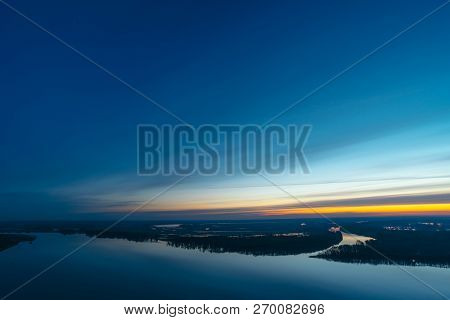 Beautiful River With Big Island With Trees Under Predawn Sky. Bright Yellow Stripe In Picturesque Cl