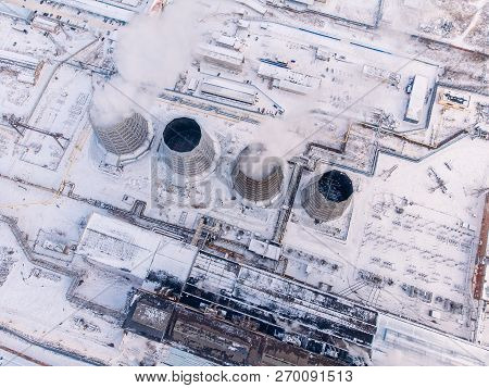 Aerial Top View Clouds Of Smoke And Steam Cooling Tower Industrial Heat Electro Central Coal. Enviro