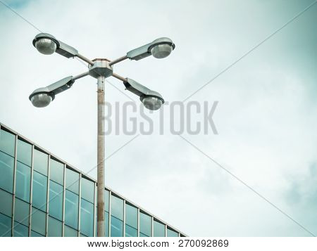 Rusty Pole And Luminaire Ring With Lighting Fixtures. With Space For Place Your Text.