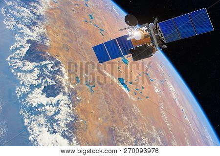 Low-orbit Communication Satellite In Space Above The Earth. Elements Of This Image Furnished By Nasa