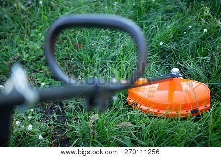 Trimmer Garden Tool For Mowing Grass On Lawn In Yard. Lawn Mower