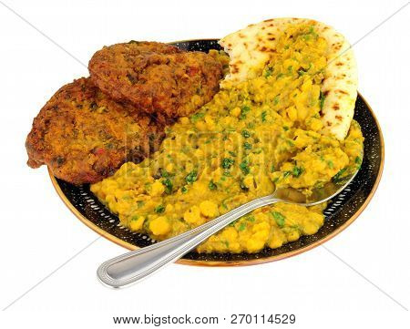 Indian Tarka Daal Meal With Onion Bhaji And Naan Bread Isolated On A White Background