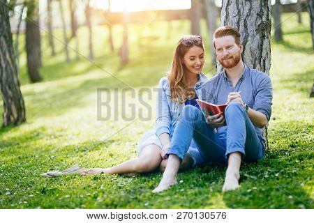 Lovely University Students Studying Outdoors In Park