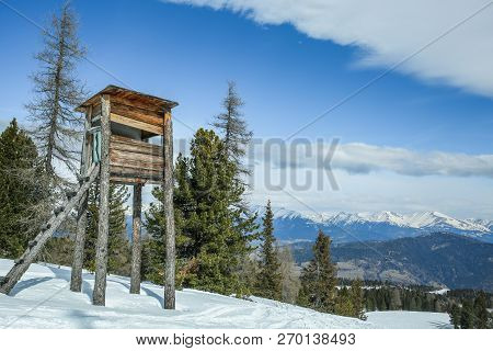 Wooden Hunting Tower In The Winter Forest In The Mountains