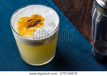 Spicy Pisco Sour Cocktail Made With Lime Juice, Egg White And Peruvian Grape Schnaps.