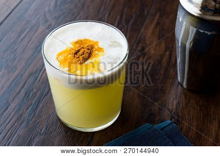 Spicy Pisco Sour Cocktail Made With Lime Juice, Egg White And Peruvian Grape Schnaps.