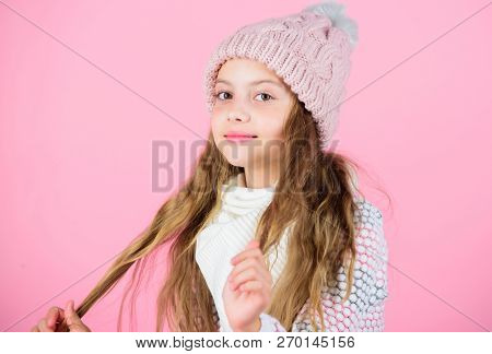 Girl Wear Knitted Hat Pink Background. Prevent Winter Hair Damage. Winter Hair Care Tips You Should 