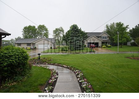 Front Yard In A Residential Neighborhood In Summer During A Rainstorm, Green, Lush